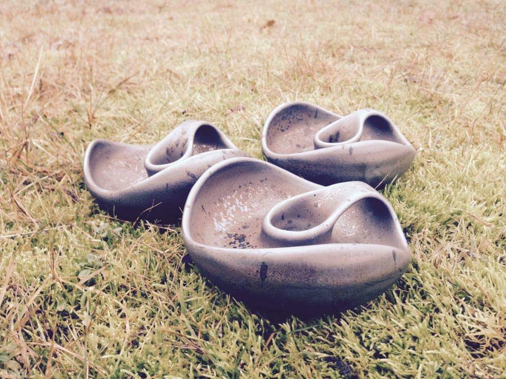 Handmade bowls by Tenis Preiss photographed on grass
